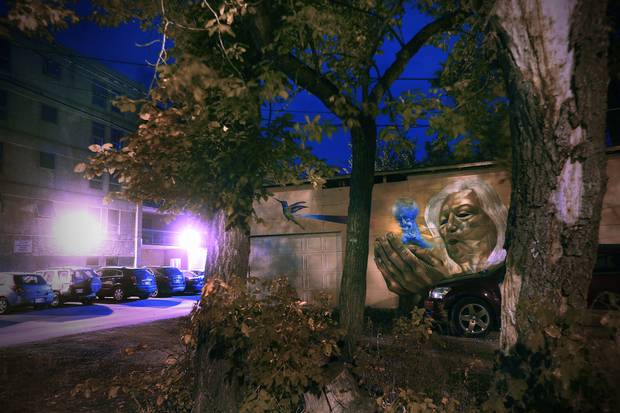 Gaia shows an older woman with a hummingbird by Nereo II on a sushi restaurant in the West End.