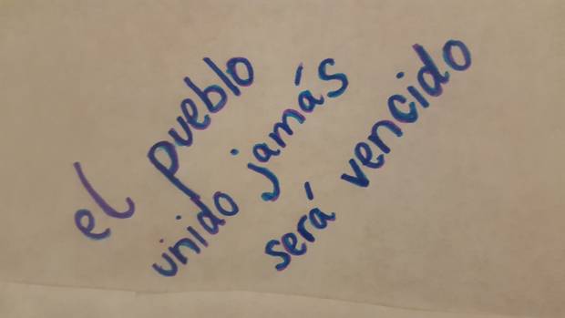One message, in Spanish, reads: ‘The people united will never be defeated.’