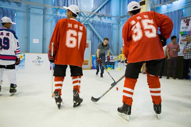 McDavid trades shots with students at the elite Beijing 101 Middle School.