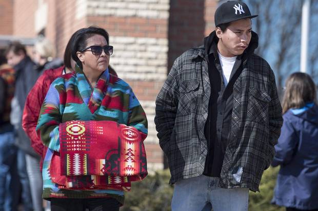 Debbie Baptiste, mother of Colten Boushie, and her son Jace Baptiste leave the provincial court during a stoppage in proceedings during the first day of preliminary hearing investigating the murder of Boushie, in North Battleford, Sask. April 3.