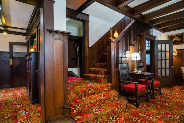 A 'phone booth' sits off the landing of the staircase to the second floor.