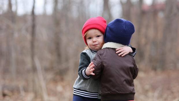 Jude McGee, left, died of the flu in May. His mother, Jill Promoli Mcgee, remembers how he loved dandelions; now, whenever she sees one, she makes a wish.