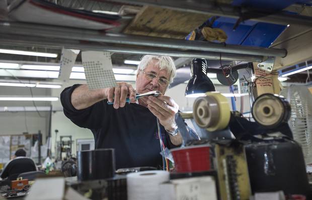 Stefan Slave works on the factory floor at Plitron Manufacturing Inc., in Toronto on Nov. 2, 2015.