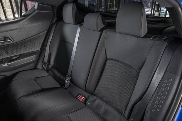 The back seat fits two comfortably, but three is a bit of a squeeze.