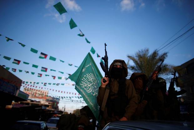 Palestinian Hamas militants take part in a protest in the northern Gaza Strip.