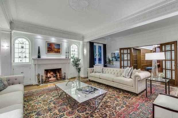 The living room's wallpaper was removed and the walls painted white.