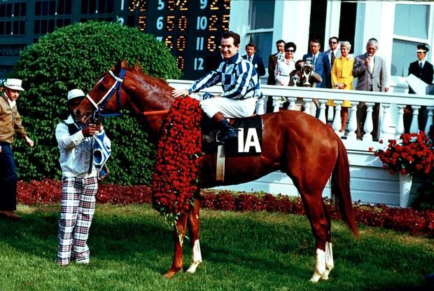 Secretariat and jockey Ron Turcotte pose in the winner's circle after winning the 1973 Kentucky Derby at Churchill Downs in Louisville, Ky., on May 5, 1973. Secretariat won the 99th Run for the Roses in a record 1:59 2/5, becoming the first horse to complete the 1 1/4-mile course for the Kentucky Derby in less than two minutes.