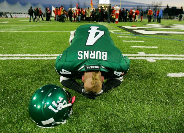 University of Saskatchewan Huskies' player Oliver Burns lays his head on the ground after losing the Vanier Cup to the Laval Rouge et Or in November, 2006, in Saskatoon.