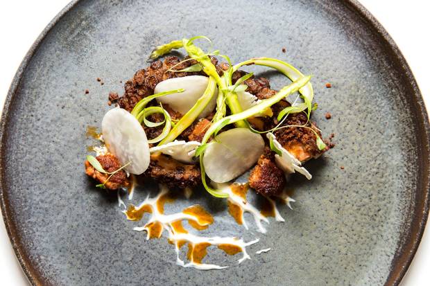 Chewy charred octopus is layered with two types of chorizo – housemade sausage and a spicy vinaigrette.