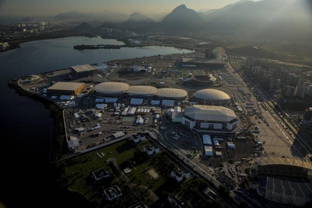 The 2016 Summer Olympics park is seen under construction in this aerial photograph taken above the Barra da Tijuca area of Rio de Janeiro. Brazil’s federal government has agreed to provide emergency funding to Rio de Janeiro state after the host of this year's summer Olympics declared an emergency as it runs short of cash weeks before the start of the games.