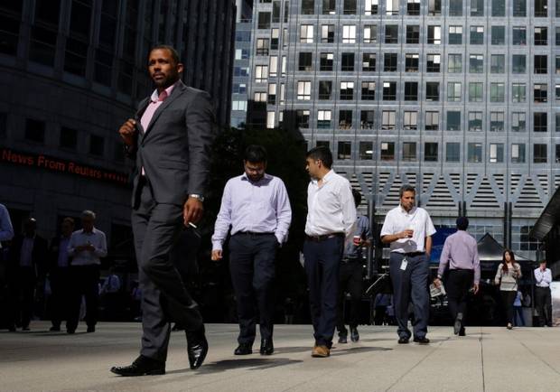 People walk through Canary Wharf, London’s financial district, on Sept. 8, 2016.