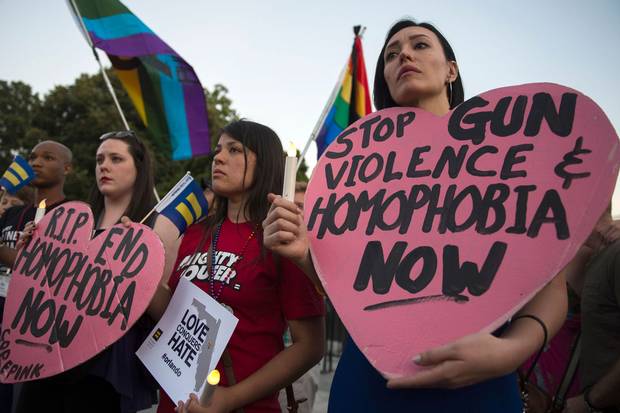 June 12, 2016: Mourners in Washington, D.C., hold a vigil for the deadly shooting at a gay nightclub in Orlando, Fla., the night before.