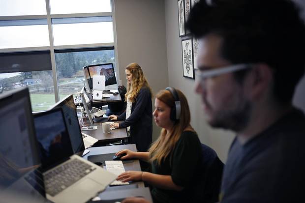 Robyn Ward, Jordan Hrenyk and Dakota Lightning work on projects at the Songhees Innovation Centre.