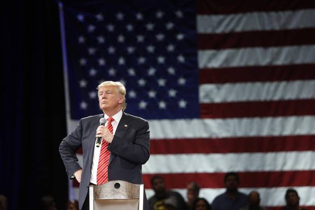Republican presidential candidate Donald Trump speaks to supporters during a town hall meeting at the Tampa Convention Center in Florida a day before the Republican primary on March 15.
