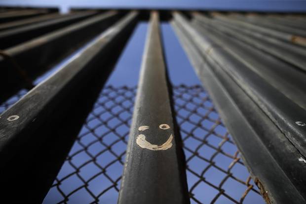 Graffitti adorns metal bars marking the United States border where it meets the Pacific Ocean Wednesday, March 2, 2016, in Tijuana, Mexico. Trump has angered many Mexicans for his campaign rhetoric denigrating some immigrants as 
