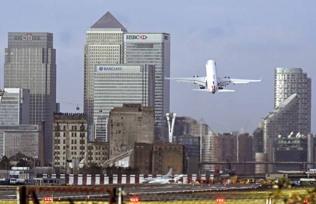 A British Airways plane takes off at London City Airport.