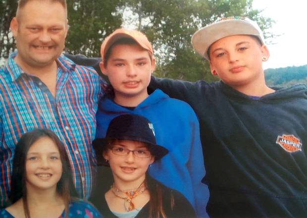 Retired Sgt. Ron Anderson with his four children. The picture was taken on the first day of school in September, 2013.