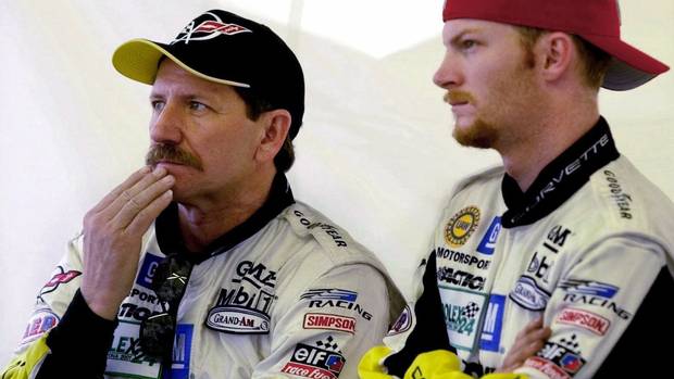 7 Dale Earnhardt, left, and his son Dale Earnhardt, Jr., right, from Kannapolis, N.C., watch from the pit area at Daytona International Speedway as their GTS class Corvette powers through the grandstand straightaway Thursday, Feb. 1, 2001, in Daytona Beach, Fla. Earnhardt Sr., one of the greatest stars in auto racing history, died Sunday from injuries in a last-lap crash at the Daytona 500, NASCAR officials said.Daytona.(AP Photo/Amy Conn)