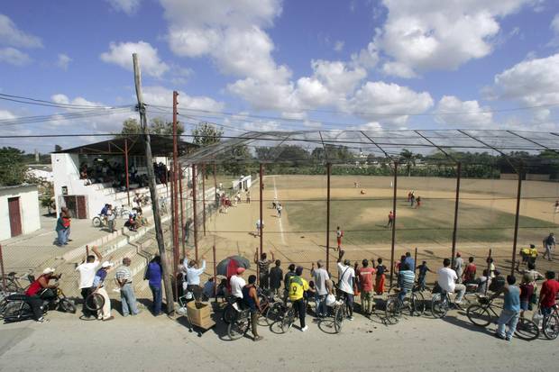 **FILE PHOTO** (NYT80) HAVANA, Cuba -- April 25, 2007 -- BBO-CUBA-2 -- Local residents watch a baseball game outside of Havana in this March 16, 2006 file photo. Major League Baseball officials are quietly preparing to re-establish the league's relationship with Cuba if the United States lifts its trade embargo on the island.