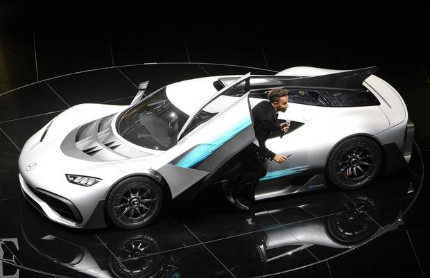 F1 racing driver Lewis Hamilton presents a Mercedes AMG Project One car at the Frankfurt Motor Show on Sept. 12, 2017.