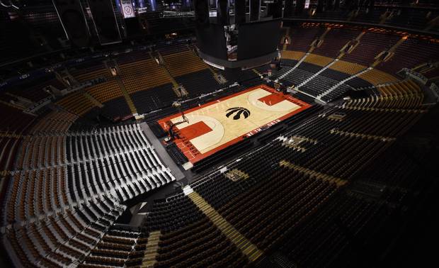 Following the Toronto Maple Leaf's final playoff game, workers convert the Air Canada Centre from a hockey rink to a basketball court on April 24 2017 in preparation for the Toronto Raptors basketball team's game tonight.