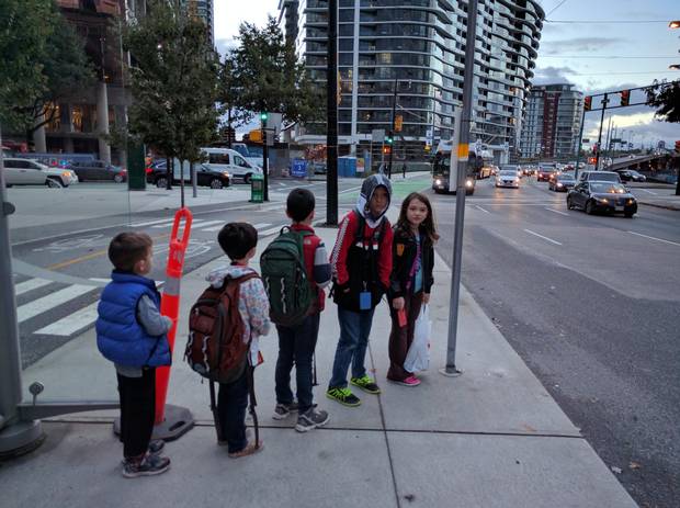 Adrian Crook's kids wait for the bus.