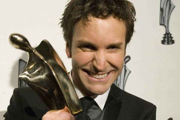 Éric Salvail holds up his trophy for best variety show host at the Artis television gala in Montreal on April 29, 2007.