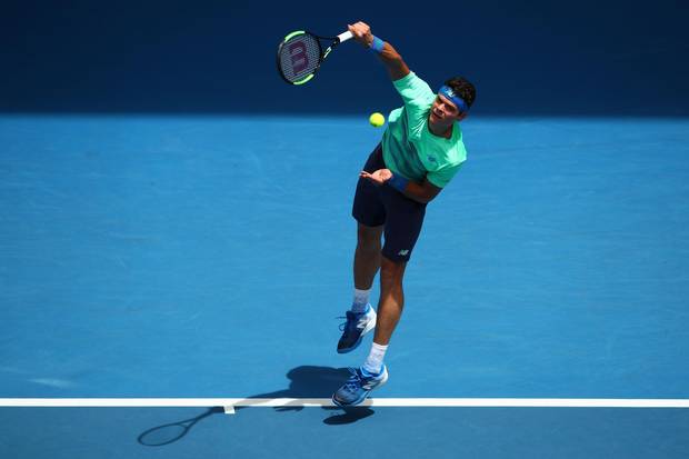 Milos Raonic serves in his first round match against Dustin Brown on day two of the 2017 Australian Open.