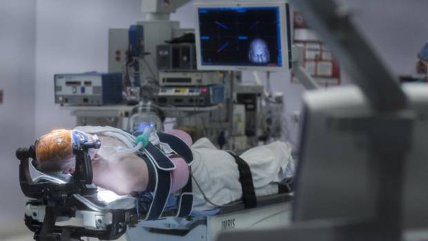 Larry Doherty, 64, from Bow Island, Alta, in surgery.