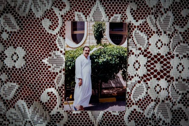 A family photo shows Mr. Sharbaji in his garden, a few years before fleeing Syria.