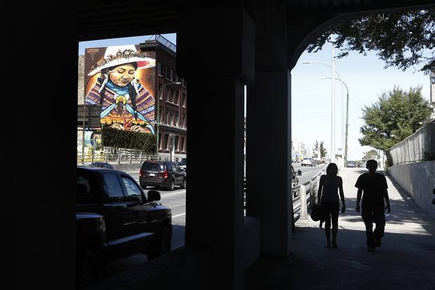 Mending by Bruno Smoky and Shalak Attack is a portrait of an indigenous women mending a heart. It is located on North Main Street in the North End.