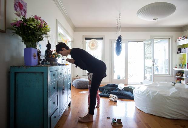 Carina Stone bows as she pauses at a small vigil for her husband Michael Stone him at their home on Pender Island, B.C.
