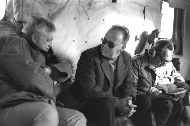 Mr. Peres, right, then the defence minister, sits next to prime minister Yitzhak Rabin, middle, and security adviser Ariel Sharon, left, on a military helicopter flight in 1975.