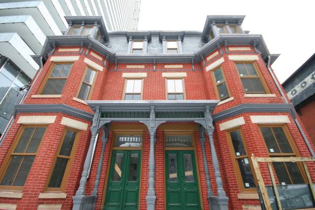 The semi-detached, Second Empire homes at 62 – 64 Charles St. E., Toronto, built by contractor Arthur Coleman and painter Thomas Smith in 1885.