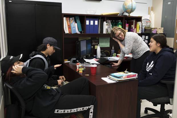 A typical lunch hour at Dryden High School: Students drop in to spend time with graduation coach Kieran McMonagle. If they’re hungry, they can always help themselves to snacks.