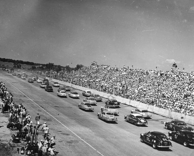 DARLINGTON, SC - 1950'S: (L-R) Fonty Flock, Tim Flock, Junior Johnson, Herb Thomas. Two Oldsmobiles and two Hudson Hornets race in Darlington, South Carolina in the 1950's. (Photo by ISC Archives via Getty Images)