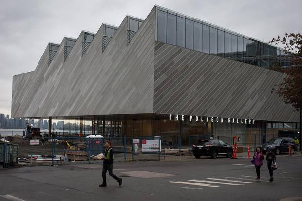 People walk past the Polygon Gallery in North Vancouver, B.C. on Oct. 16, 2017.