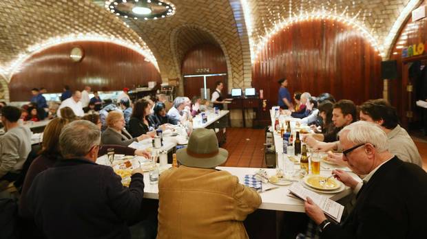 People sit in the Oyster Bar at Grand Central Terminal during centennial celebrations on the day the famed Manhattan transit hub turns 100 years old on February 1, 2013 in New York City.