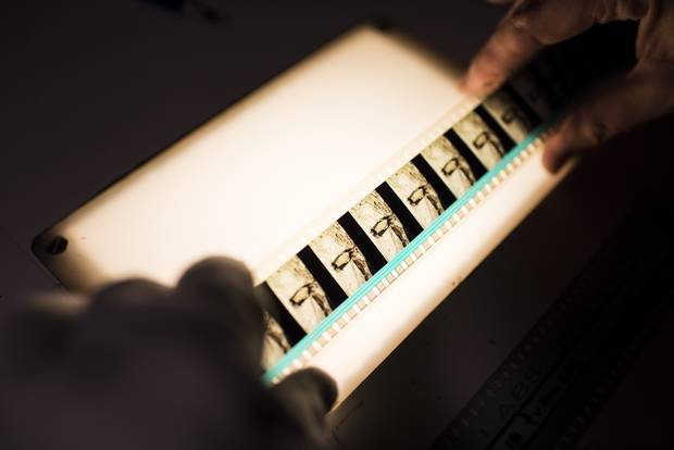 Projectionist Ingrid Lae setting up a 35 mm film prior to the 2015 Vancouver International Film Festival.