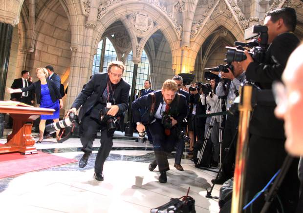 Adam Scotti ducks in front of the media pool during a welcoming ceremony with Mexican President Enrique Pena Nieto on Parliament Hill on June 28, 2016.