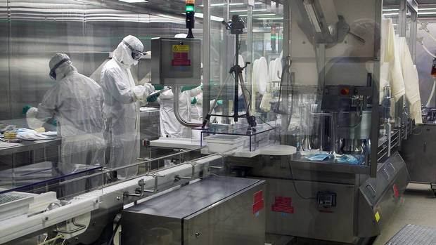 Workers at the Sainte Foy Vaccine Production Facility in Quebec City, Quebec