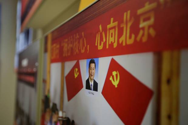 Oct. 10, 2017: A picture shows Chinese President Xi Jinping's portrait during an exhibition in Beijing displaying China's achievements for the past five years.