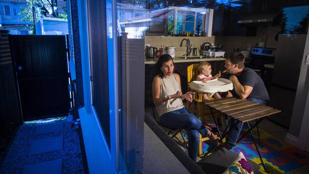 Brad Langman, Fiorella Pinillos and baby Marcelo, nine months in their Vancouver laneway home rental.