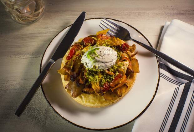 The vegetable tart is both flaky and dry, and could use a sauce of some sort to complement the overroasted ingredients.