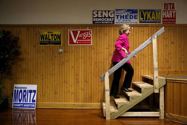 Democratic U.S. presidential candidate Hillary Clinton takes the stage to speak during the Scott County Democratic Party's Red, White and Blue Dinner at the Mississippi Valley Fairgrounds in Davenport, Iowa.
