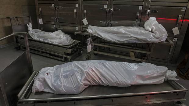 The remains of murder victims in the morgue lay in white plastic bags in San Salvador, El Salvador, May 29, 2015.