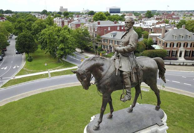 The statue of Confederate Gen. Robert E. Lee stands in the middle of a traffic circle on Monument Avenue
