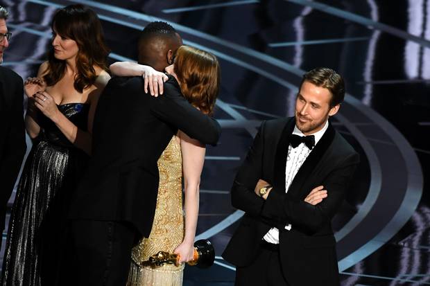 Moonlight actor Mahershala Ali hugs Emma Stone after the award mixup was uncovered.