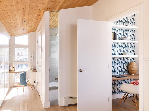 Holden-Pope added a half-floor to the upstairs, which is now a spacious bedroom with large bathroom and office nook.