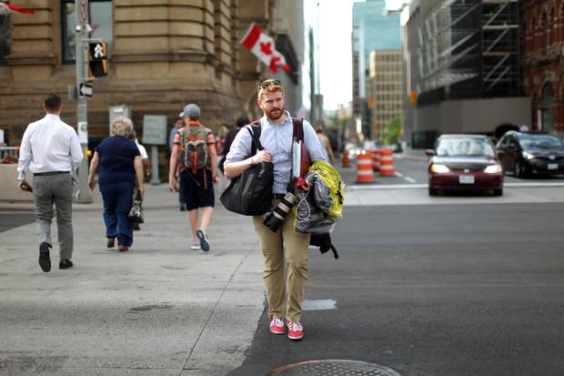 Photographer Adam Scotti on his way to work on Parliament Hill: But for an affection for craft beer (which he tracks with a smartphone app), he lives a spartan life.